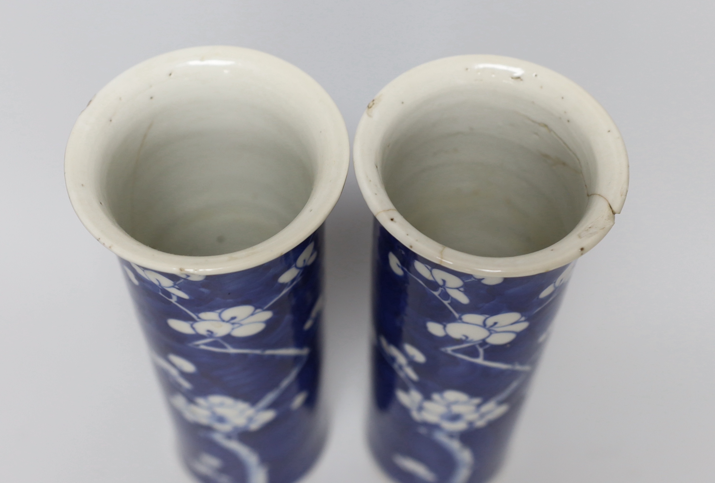 A pair of Chinese Prunus sleeve vases (a.f.), 21cm high